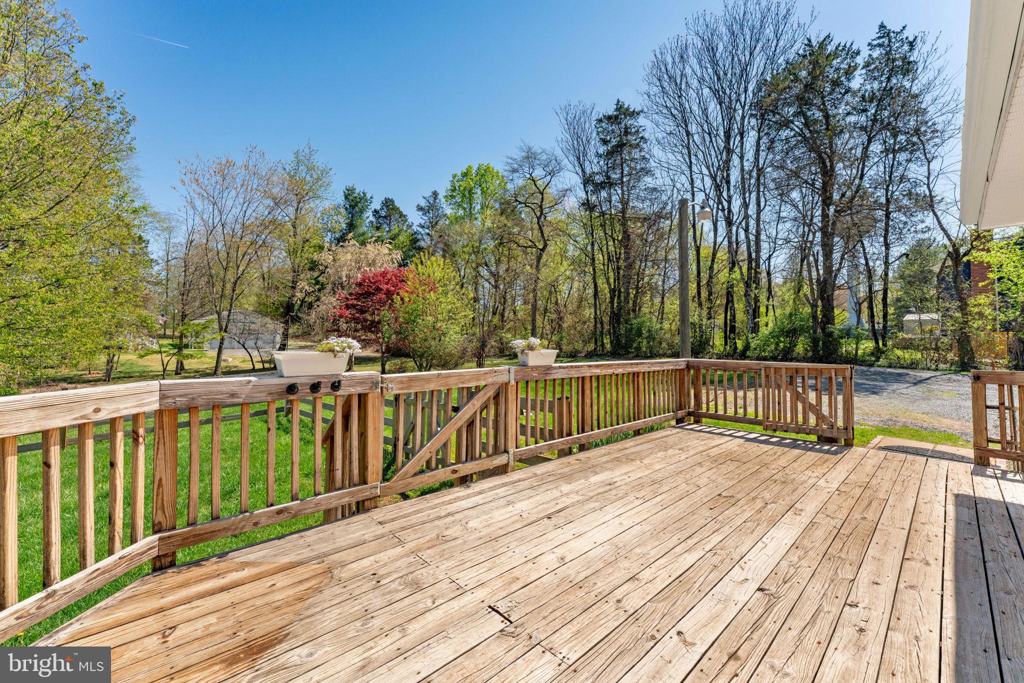 9283 Springs Road Warrenton, VA 20186 - Photo 14 of 18 a view of balcony with wooden floor and fence