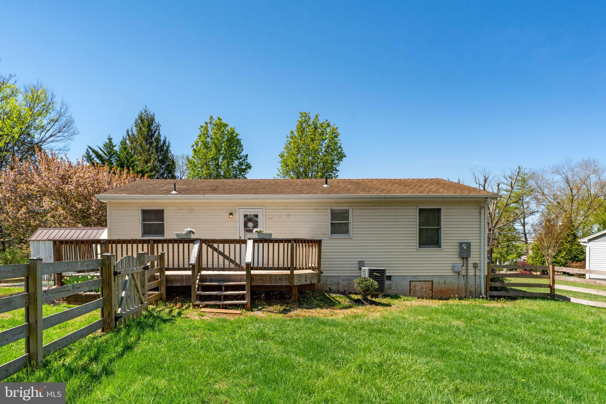 9283 Springs Road Warrenton, VA 20186 - Photo 15 of 18 a view of a house with a yard