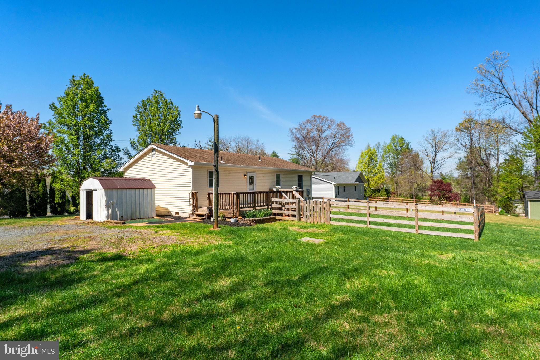 9283 Springs Road Warrenton, VA 20186 - Photo 16 of 18 a front view of a house with a yard and garage