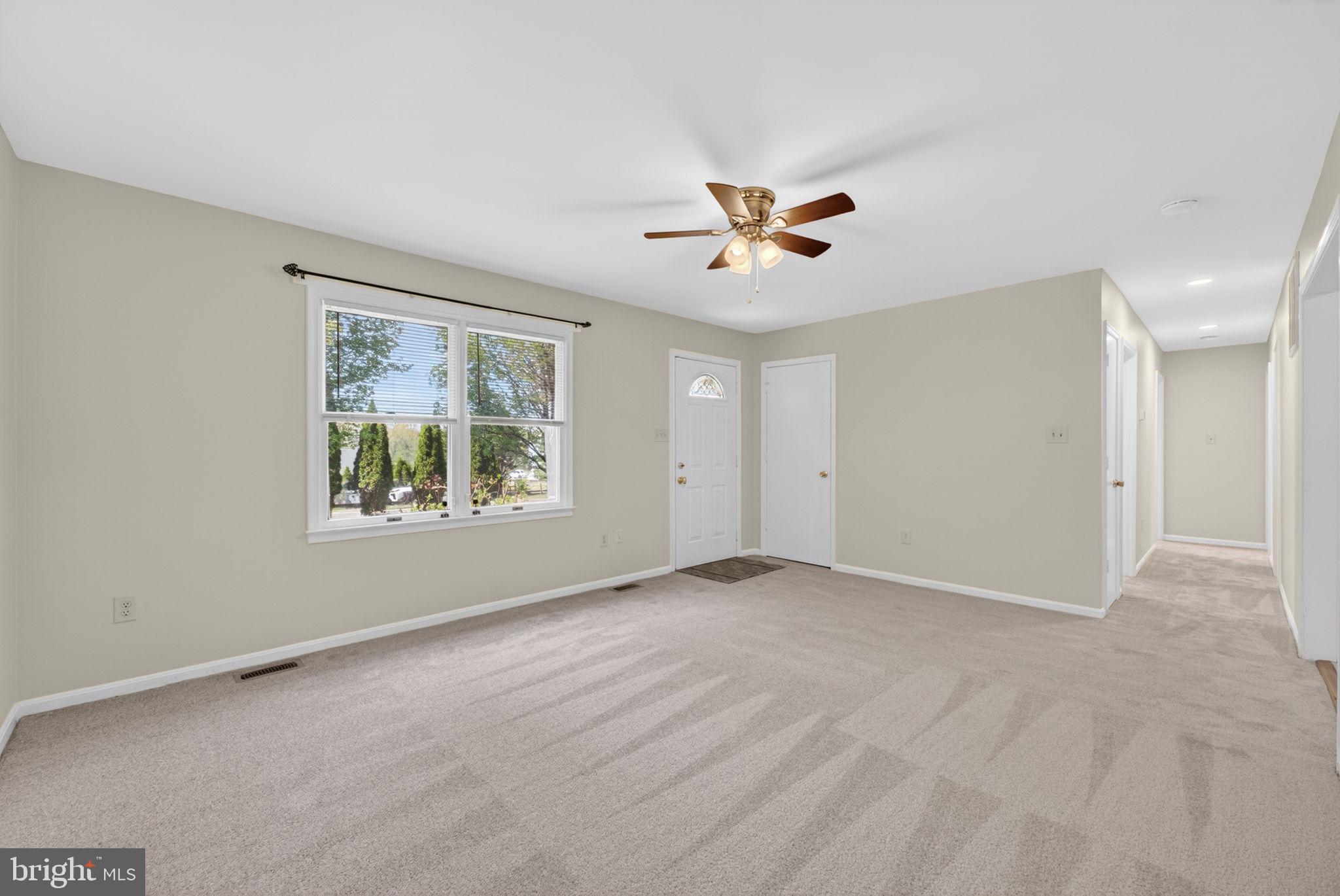 9283 Springs Road Warrenton, VA 20186 - Photo 3 of 18 a view of an empty room with a window