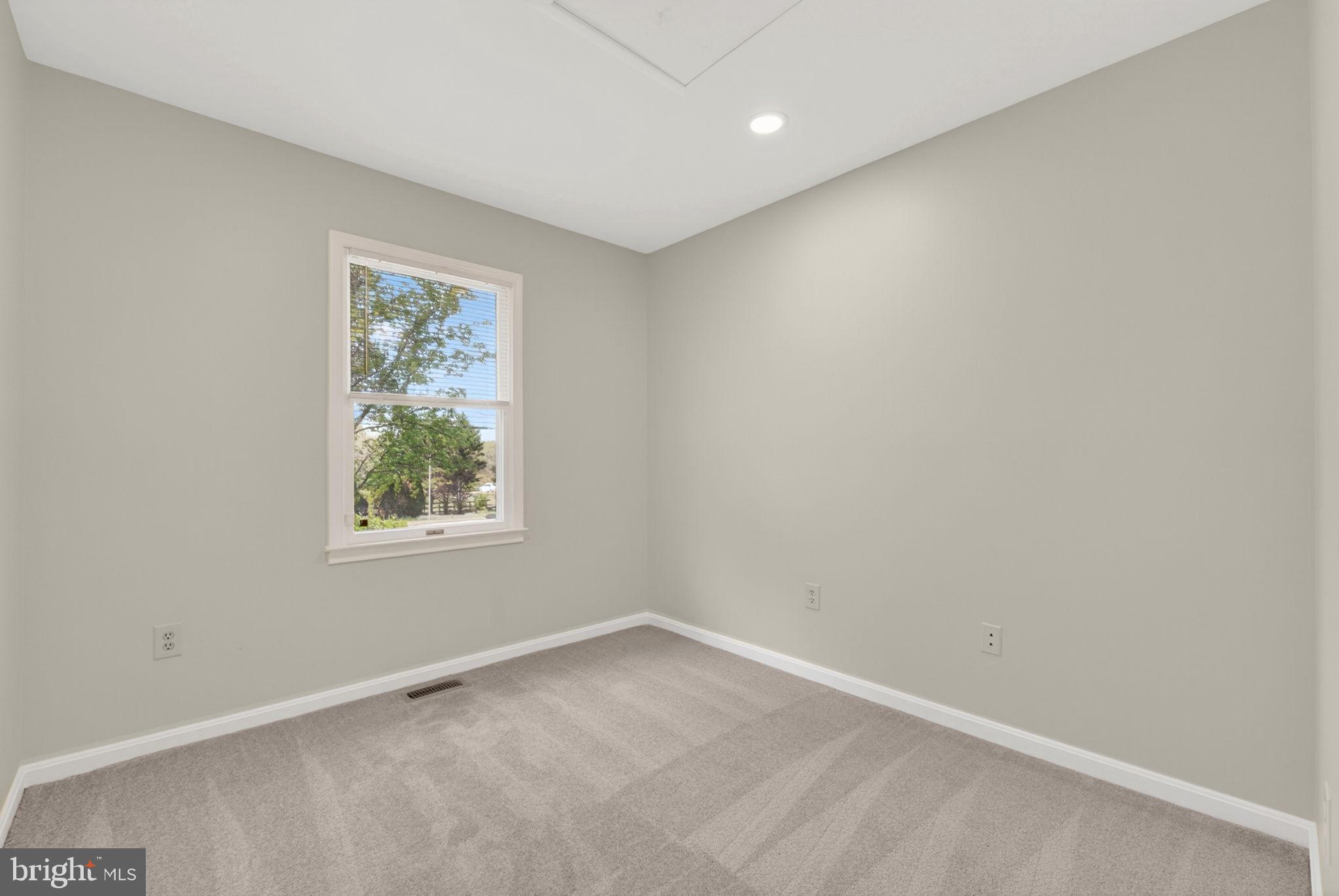 9283 Springs Road Warrenton, VA 20186 - Photo 4 of 18 an empty room with a window