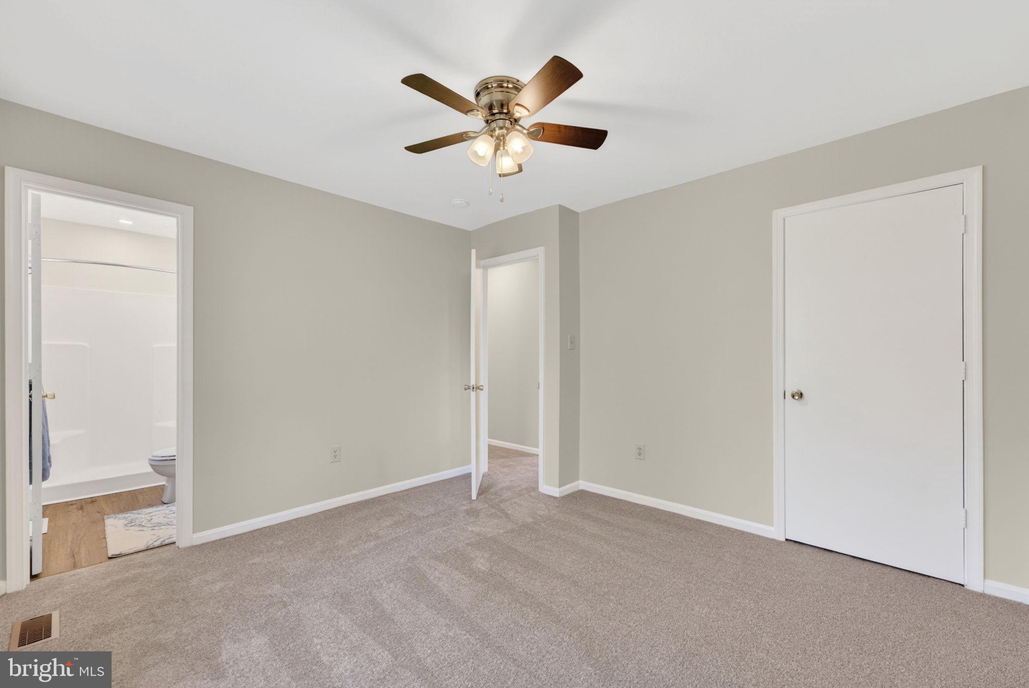 9283 Springs Road Warrenton, VA 20186 - Photo 7 of 18 a view of an empty room with a ceiling fan