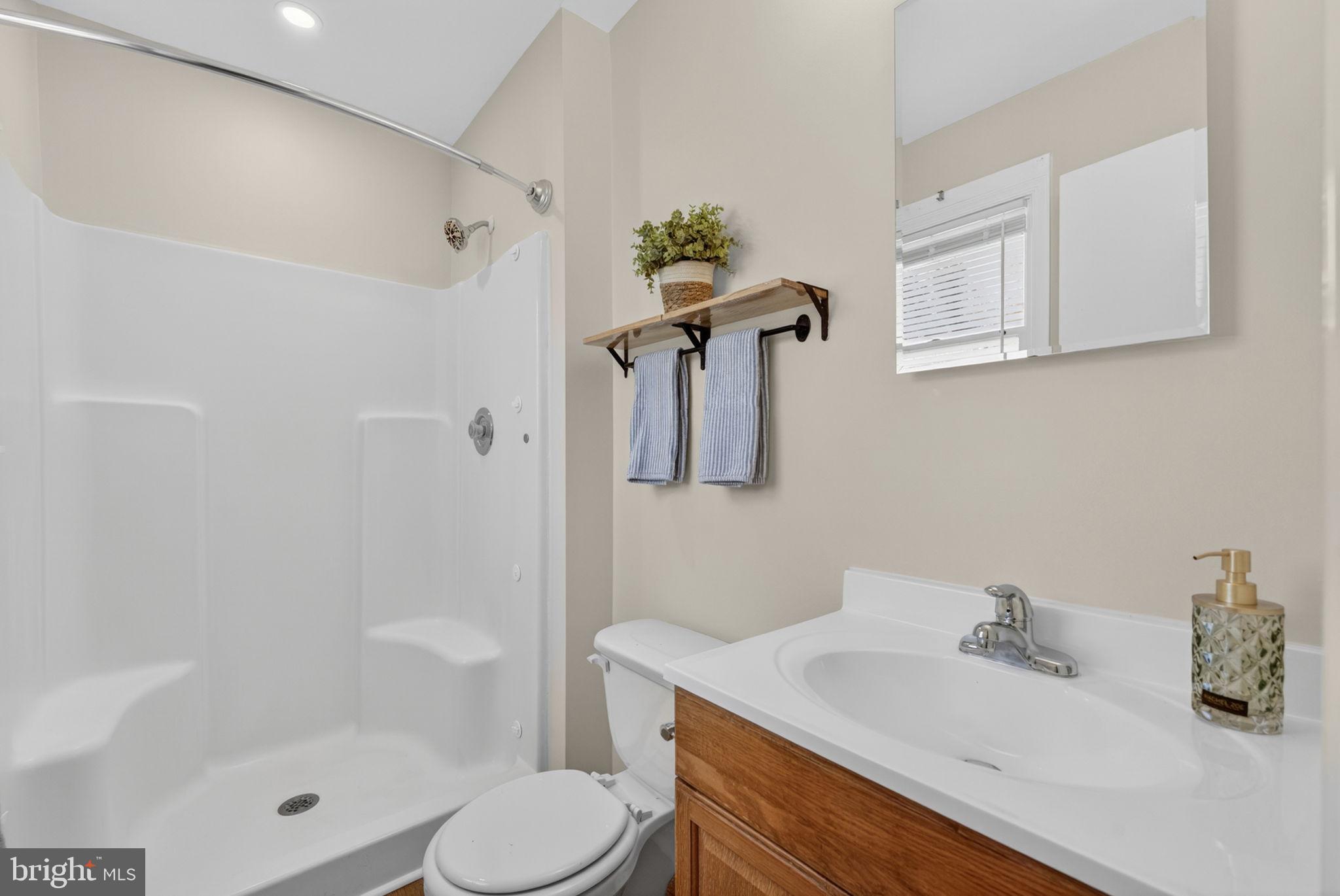 9283 Springs Road Warrenton, VA 20186 - Photo 8 of 18 a bathroom with a sink toilet and shower