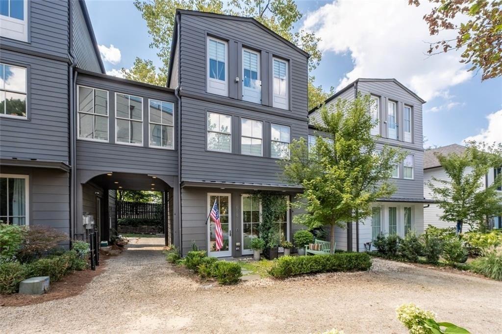 front view of a brick house with a small yard