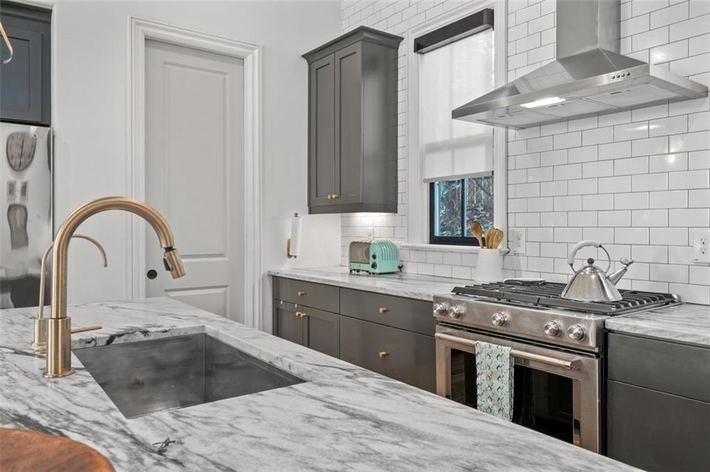 518 Bismark Road Northeast Atlanta, GA 30324 - Photo 11 of 23 a kitchen with a stove and a sink