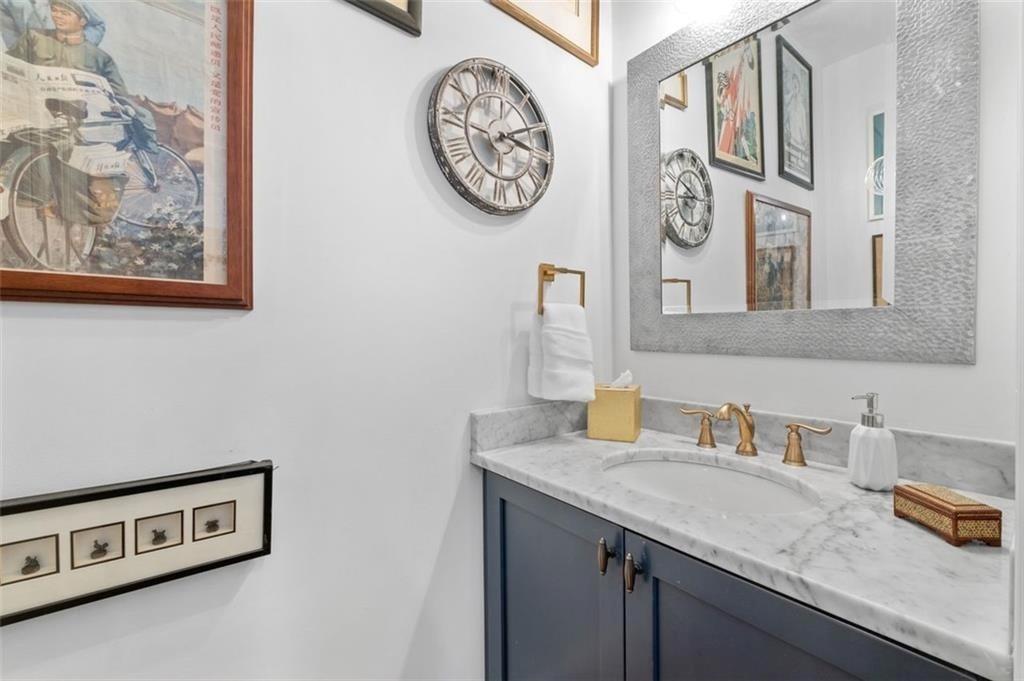 518 Bismark Road Northeast Atlanta, GA 30324 - Photo 12 of 23 a bathroom with a granite countertop double vanity sink and a mirror