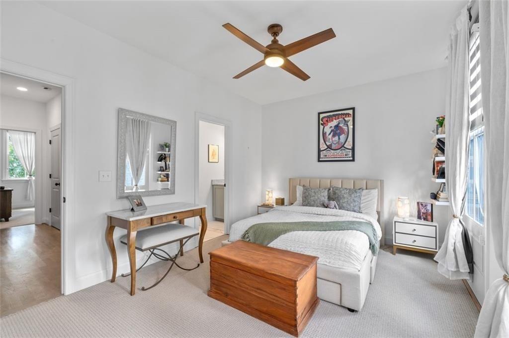 518 Bismark Road Northeast Atlanta, GA 30324 - Photo 18 of 23 a bedroom with a bed and a chandelier