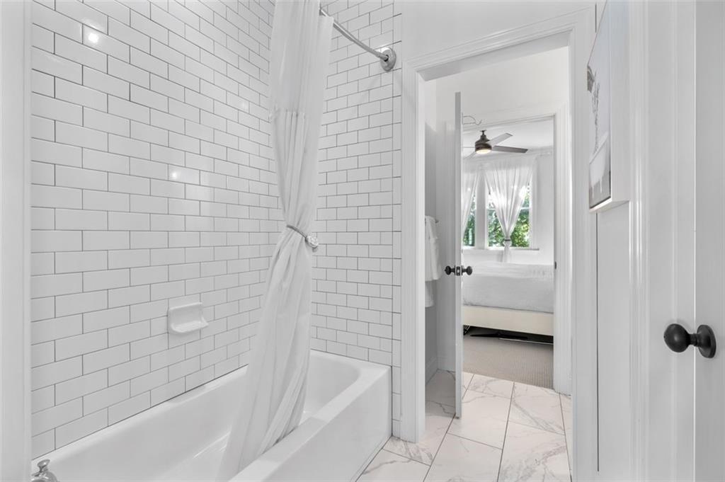 518 Bismark Road Northeast Atlanta, GA 30324 - Photo 21 of 23 a bathroom with a tub shower and a sink