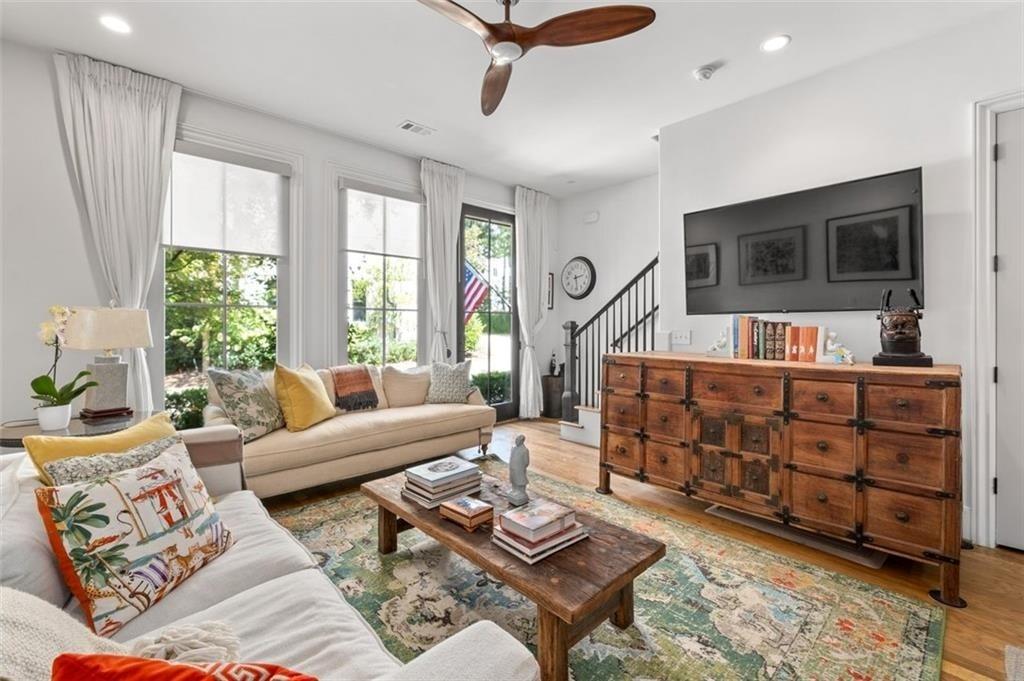 518 Bismark Road Northeast Atlanta, GA 30324 - Photo 3 of 23 a bed room with furniture and a flat screen tv