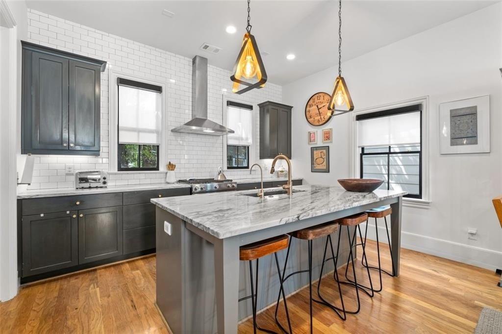 518 Bismark Road Northeast Atlanta, GA 30324 - Photo 7 of 23 a kitchen with a sink a counter space and stainless steel appliances