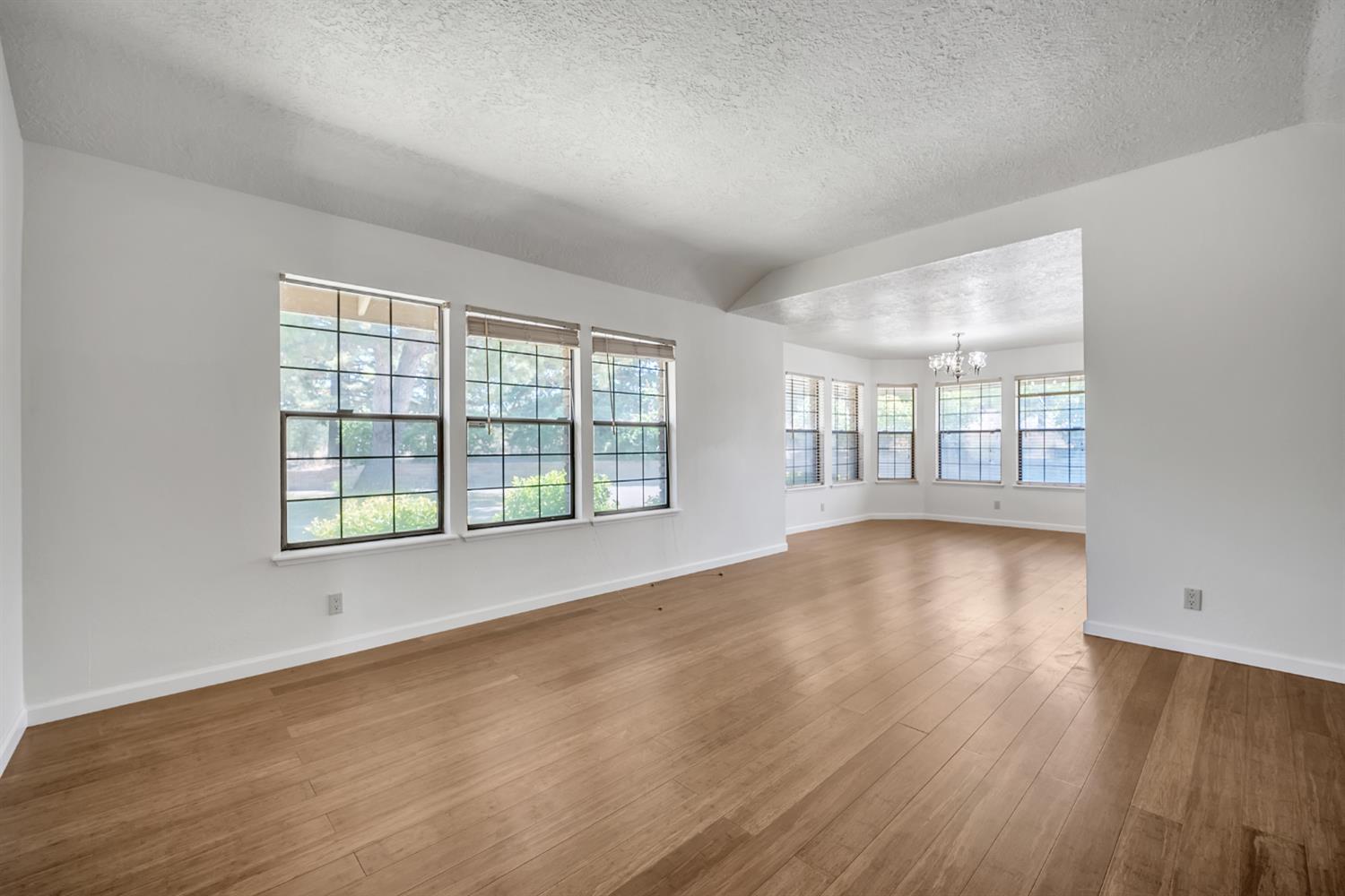 5990 Barton Road Loomis, CA 95650 - Photo 18 of 67 wooden floor in an empty room with a window