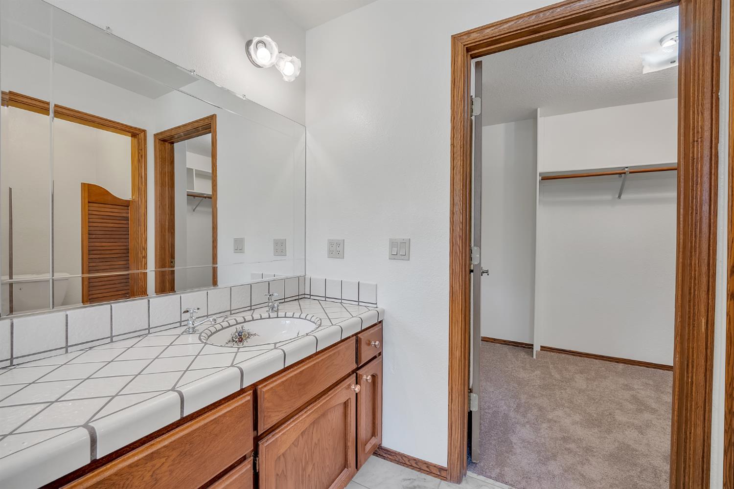 5990 Barton Road Loomis, CA 95650 - Photo 24 of 67 a bathroom with a sink and a mirror