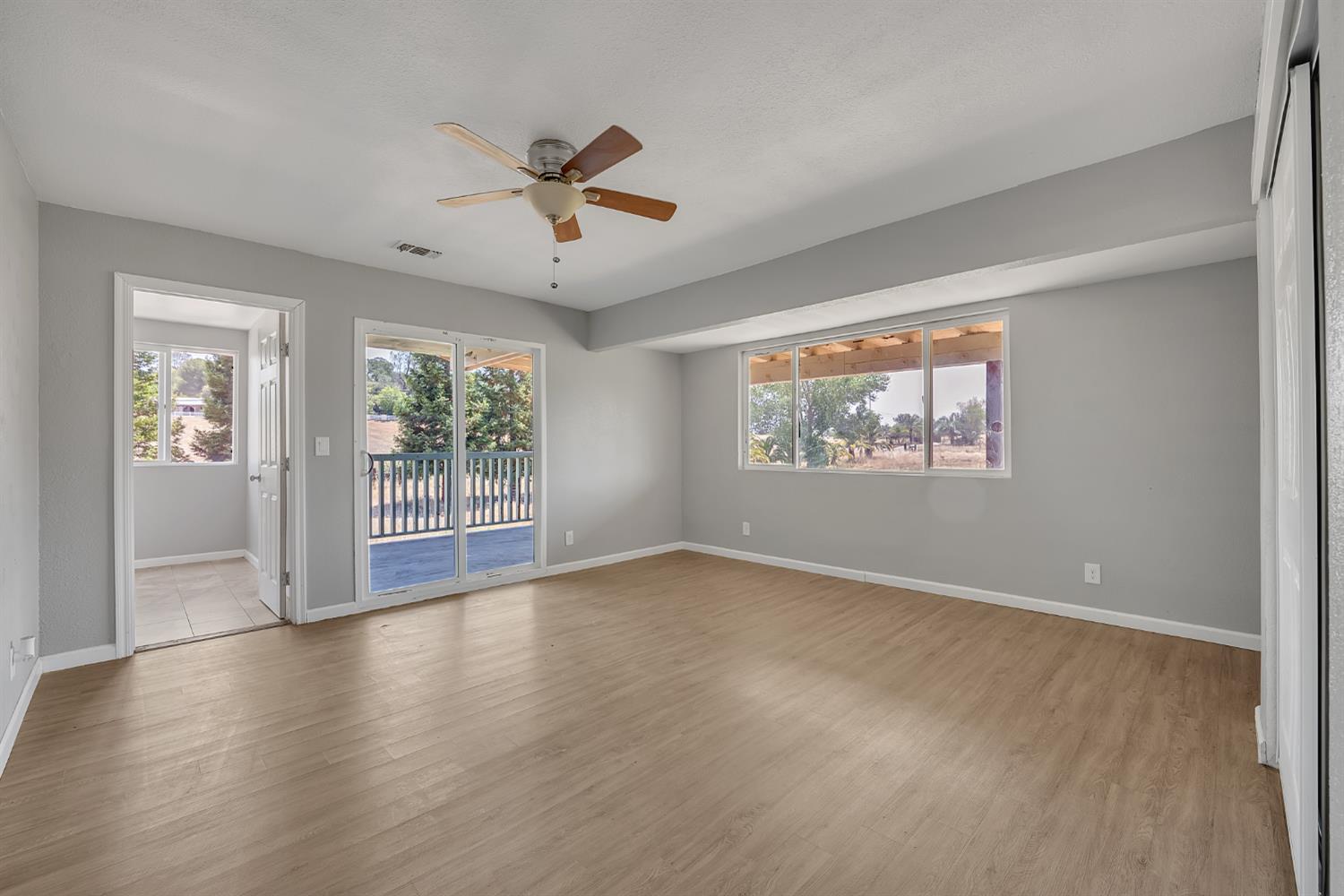 5990 Barton Road Loomis, CA 95650 - Photo 39 of 67 a view of an empty room with a window and wooden floor