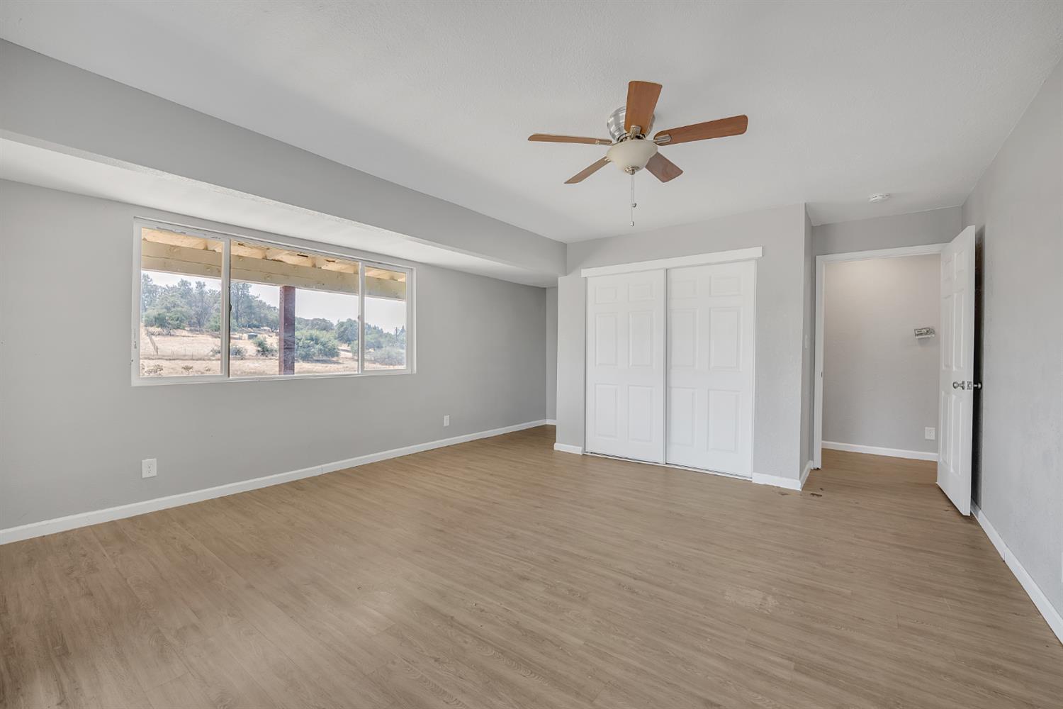 5990 Barton Road Loomis, CA 95650 - Photo 40 of 67 a view of empty room with wooden floor and fan