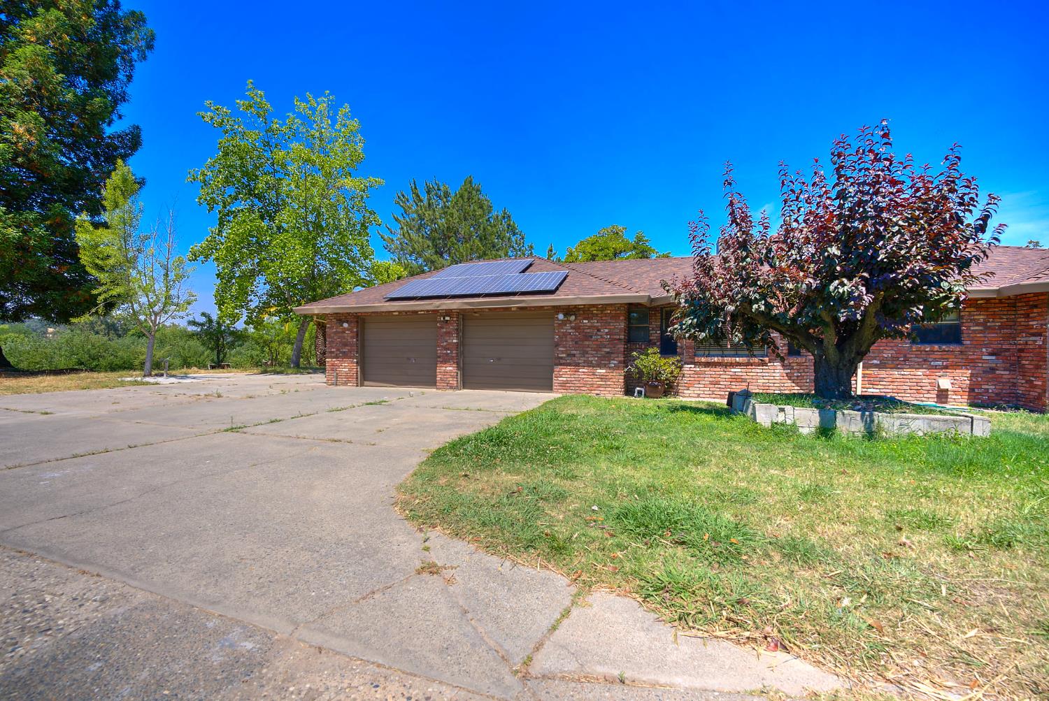5990 Barton Road Loomis, CA 95650 - Photo 51 of 67 a front view of a house with garden