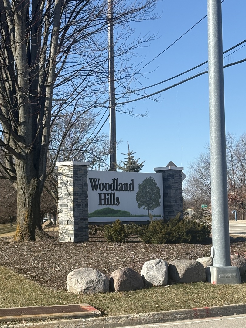 17475 Chestnut Lane Gurnee, IL 60031 - Photo 14 of 17 a sign on the side of a road