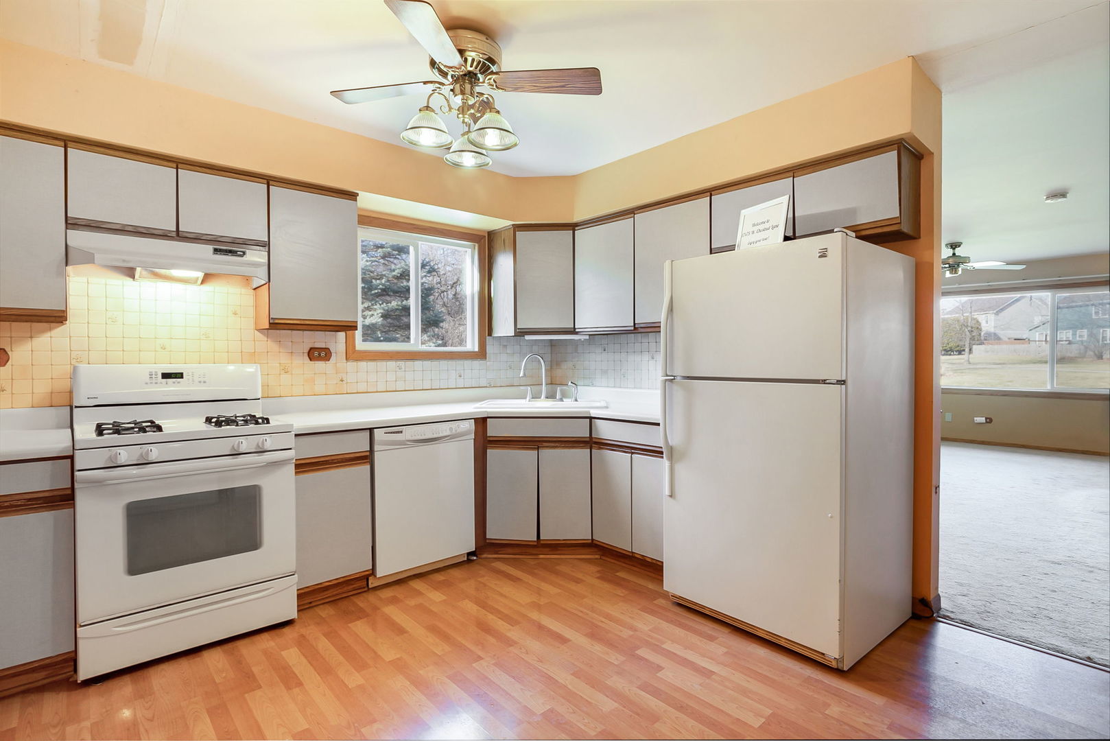17475 Chestnut Lane Gurnee, IL 60031 - Photo 5 of 17 a kitchen with a refrigerator sink and cabinets