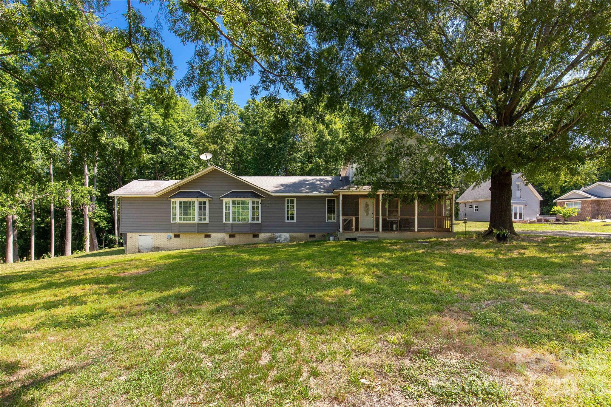 1845 State Rd S-46-149 Clover, SC 29710 - Photo 19 of 28 a front view of a house with a yard