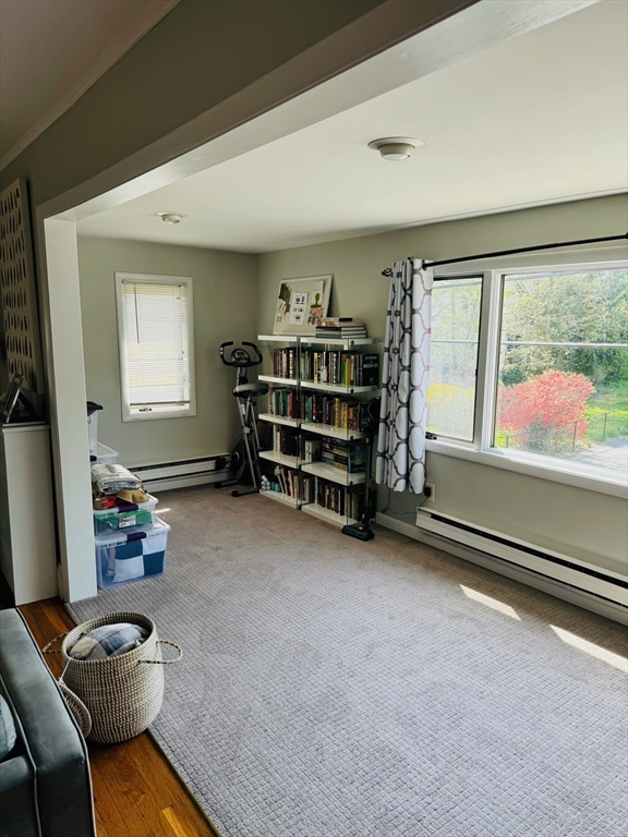 43 Chapman Street, Unit 2 Watertown, MA 02472 - Photo 10 of 12 a room with furniture and a flat screen tv