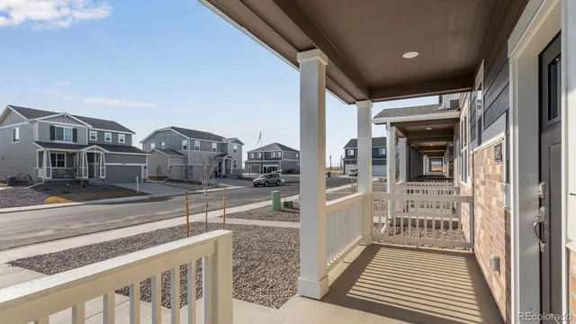 a view of a balcony with wooden floor