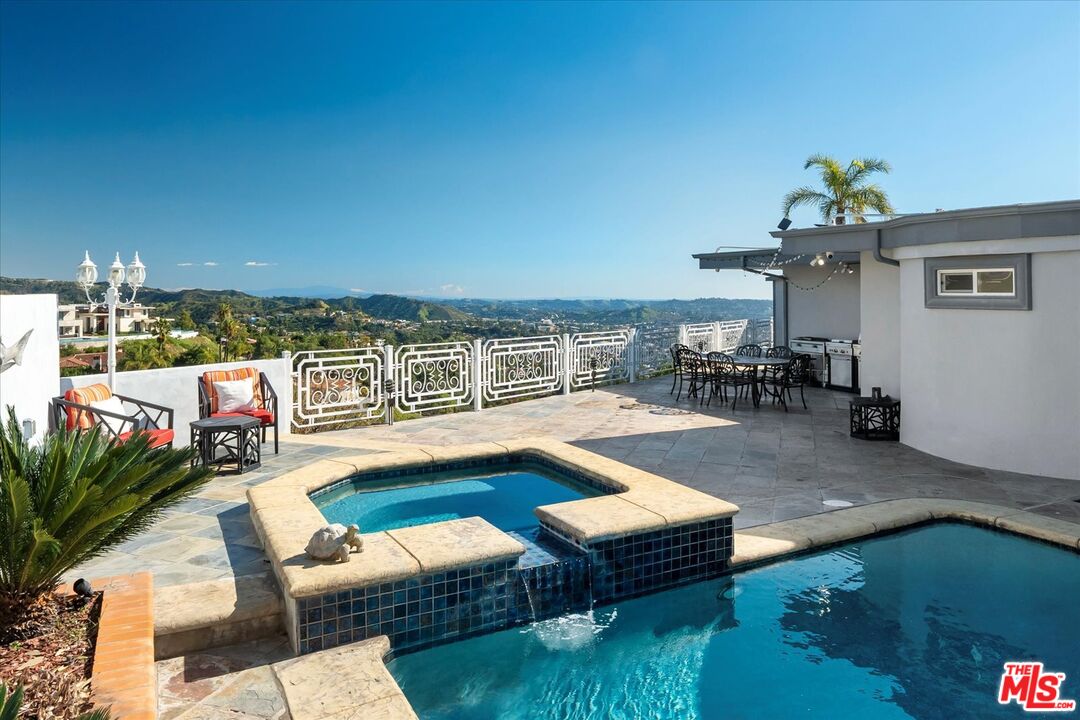 1975 Deermont Road Glendale, CA 91207 - Photo 16 of 42 a swimming pool with outdoor seating and yard
