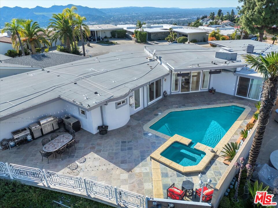 1975 Deermont Road Glendale, CA 91207 - Photo 17 of 42 an aerial view of a house with a yard patio and swimming pool