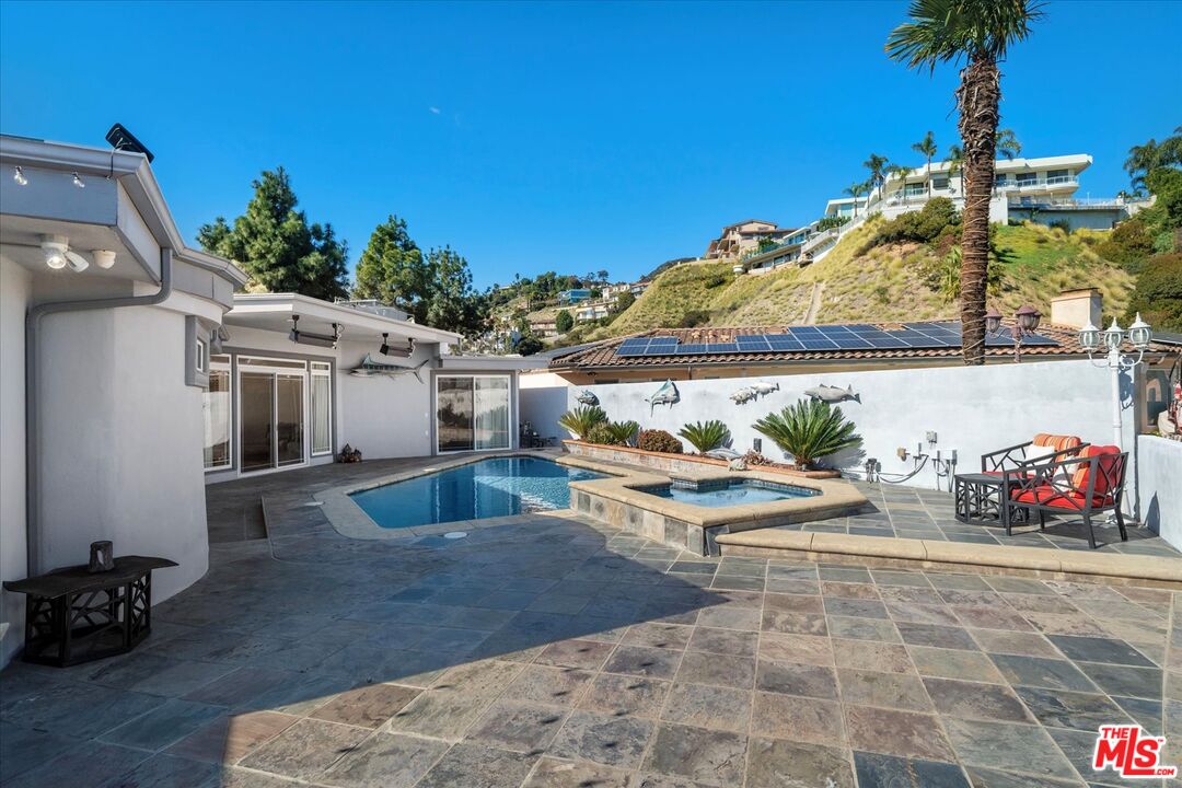 1975 Deermont Road Glendale, CA 91207 - Photo 21 of 42 a view of a patio with table and chairs potted plants