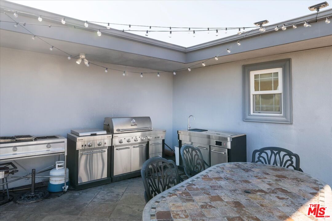 1975 Deermont Road Glendale, CA 91207 - Photo 22 of 42 a kitchen with a stove a table and chairs