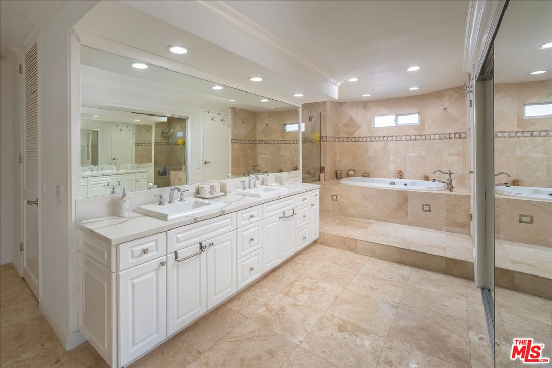 1975 Deermont Road Glendale, CA 91207 - Photo 24 of 42 a large bathroom with a double vanity sink and a mirror