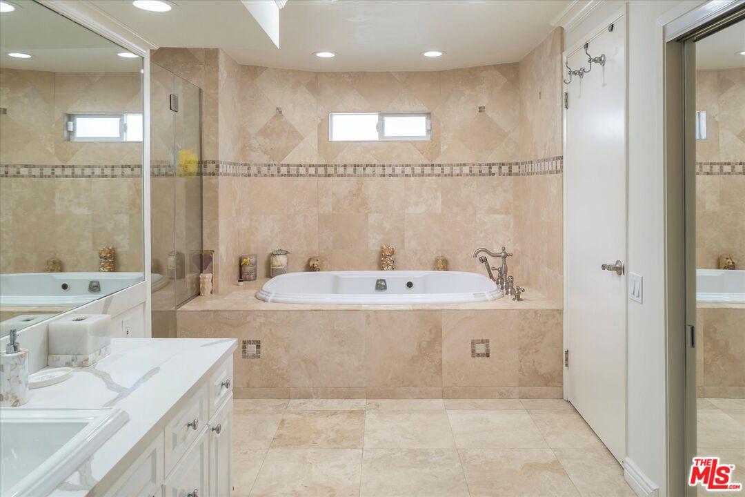 1975 Deermont Road Glendale, CA 91207 - Photo 25 of 42 a view of bathroom with a tub sink shower and mirror