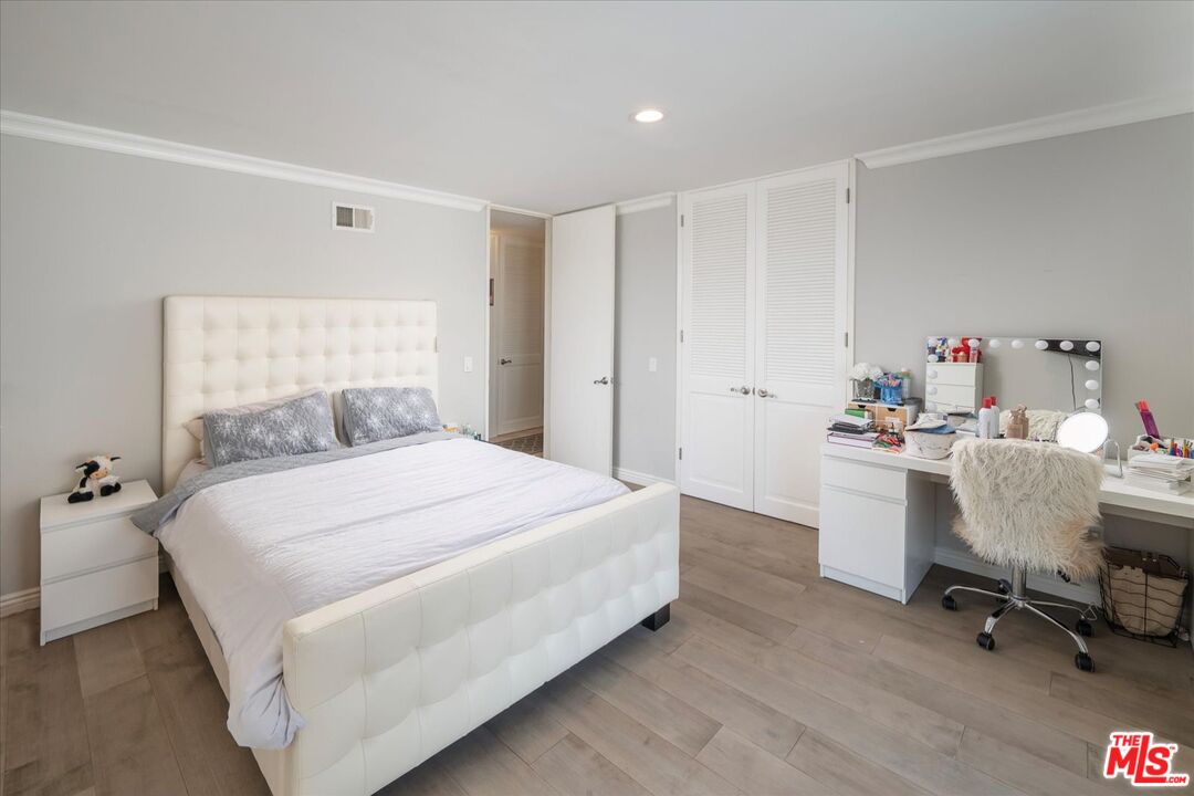 1975 Deermont Road Glendale, CA 91207 - Photo 27 of 42 a bedroom with a bed and a chair in it