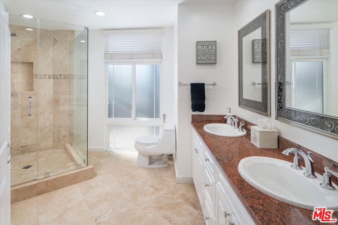 1975 Deermont Road Glendale, CA 91207 - Photo 28 of 42 a spacious bathroom with a granite countertop sink toilet and shower