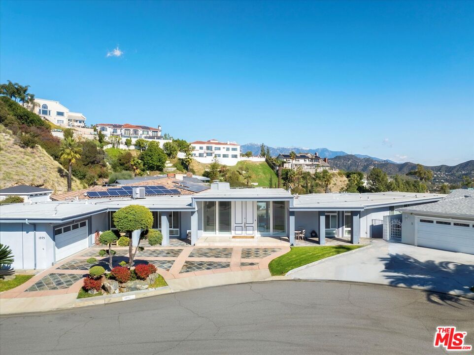 1975 Deermont Road Glendale, CA 91207 - Photo 33 of 42 a front view of house with yard and car parked