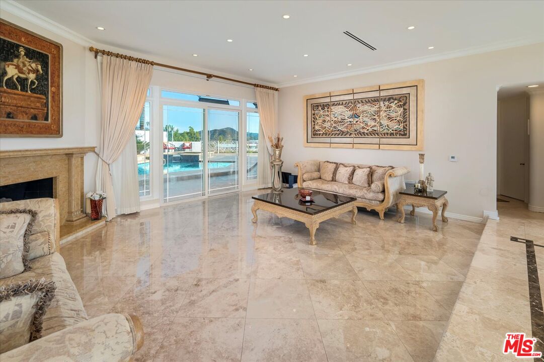 1975 Deermont Road Glendale, CA 91207 - Photo 4 of 42 a living room with furniture and a fireplace
