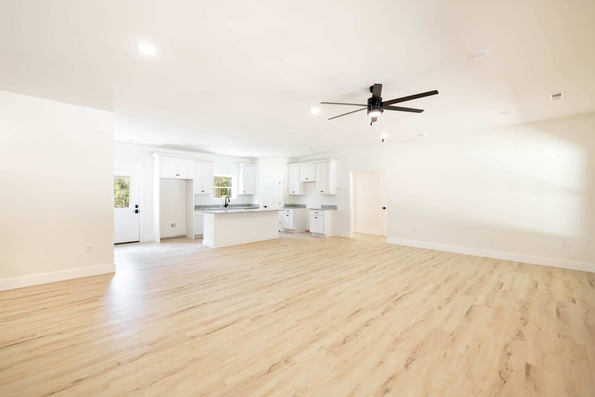37 William Teague Lane Ramer, TN 38367 - Photo 11 of 39 Open concept living area featuring light wood-finish flooring, recessed lighting, and a contemporary ceiling fan