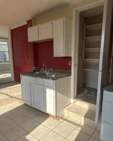 a kitchen with stainless steel appliances a cabinets and a counter top space