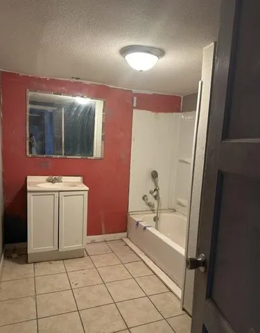 a bathroom with a bathtub sink and toilet