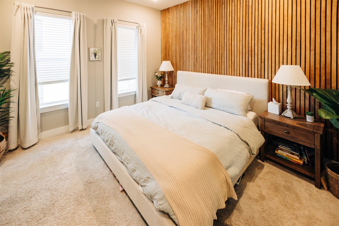 a bedroom with bed and a window