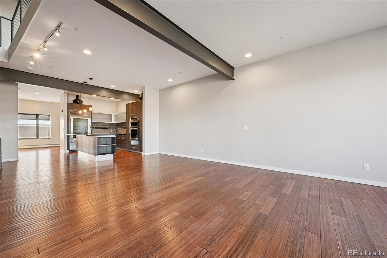 11562 Colony Row Broomfield, CO 80021 - Photo 22 of 48 a view of empty room with wooden floor