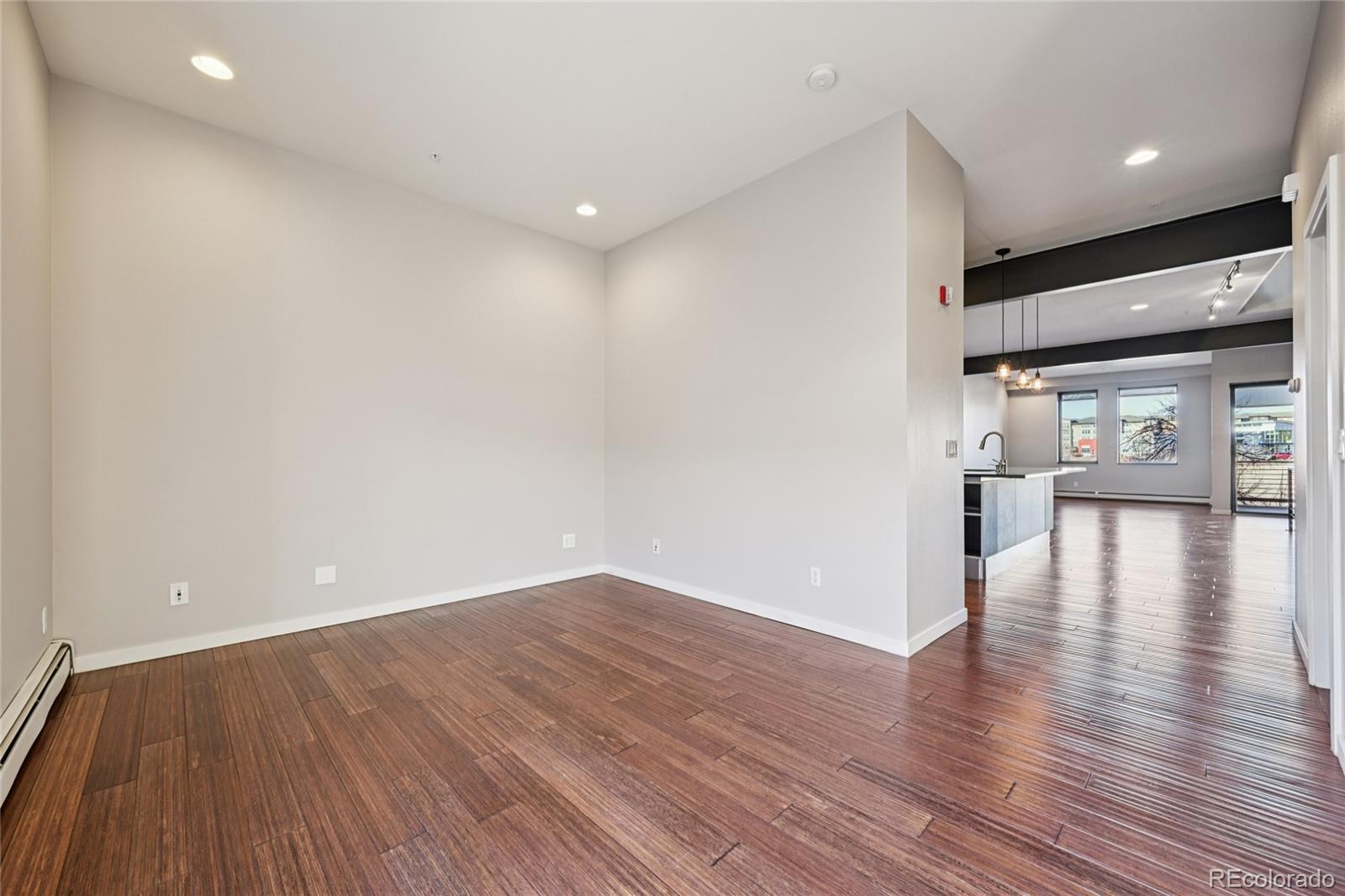 11562 Colony Row Broomfield, CO 80021 - Photo 23 of 48 a view of a room with wooden floor