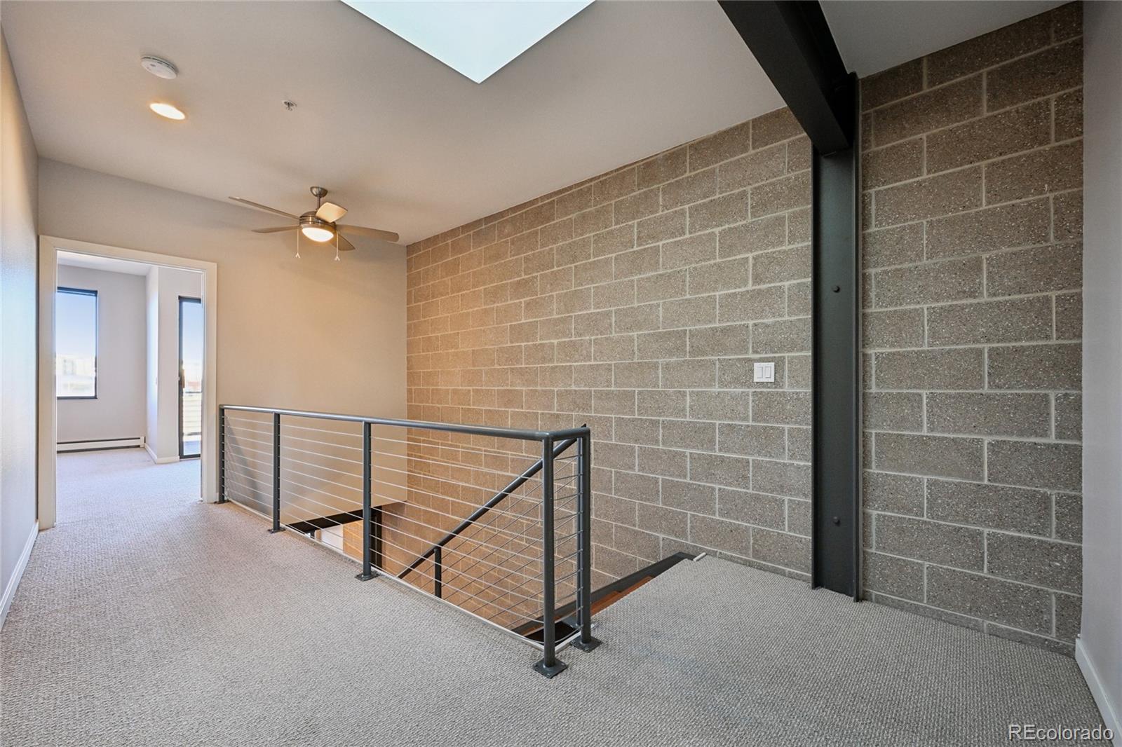 11562 Colony Row Broomfield, CO 80021 - Photo 28 of 48 a view of a hallway with a bathroom