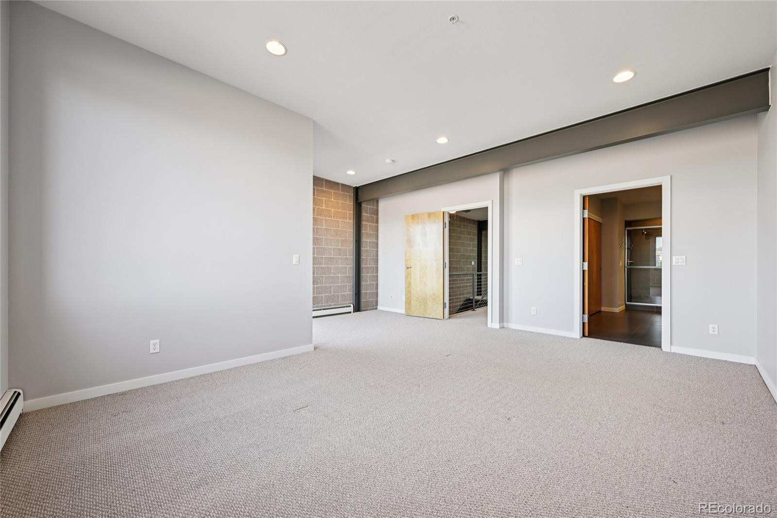 11562 Colony Row Broomfield, CO 80021 - Photo 34 of 48 a view of an empty room with wooden floor and windows