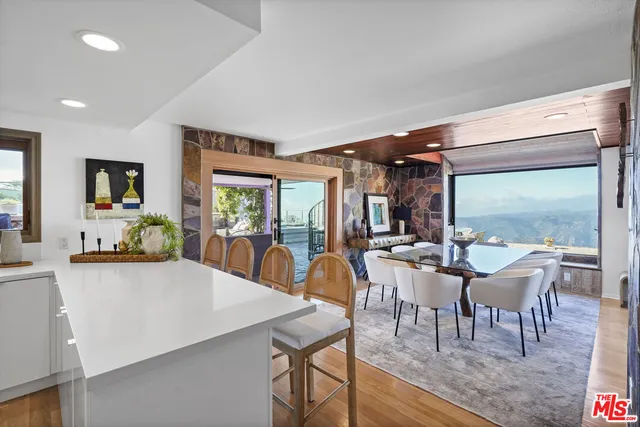 a spacious bedroom with a bed and a large window