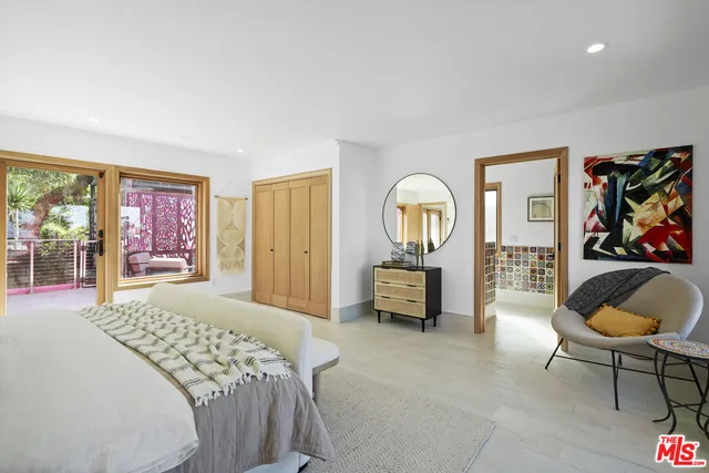 a bathroom with a double vanity sink mirror and shower