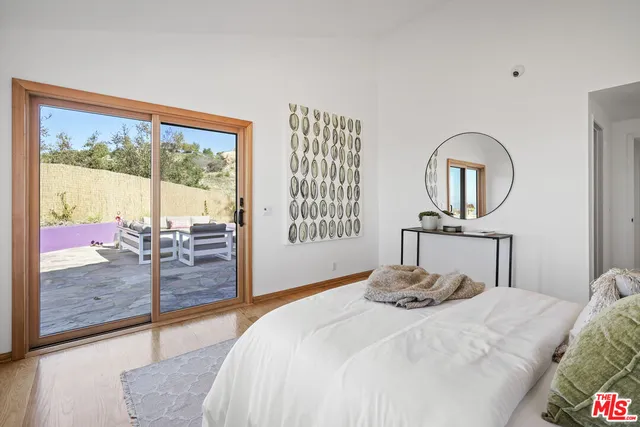 a view of a swimming pool with a yard and mountain view