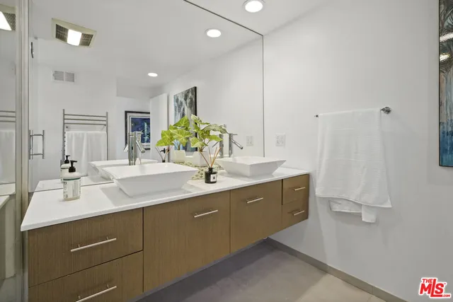 a view of a terrace with furniture and a garden