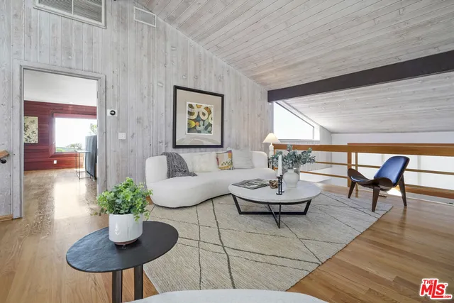 a view of a cafe with sitting area