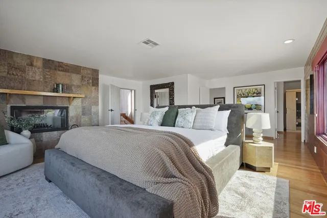 a building outdoor space with patio furniture and potted plants