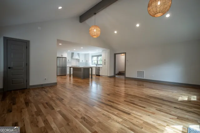 a view of kitchen with cabinets and wooden floor