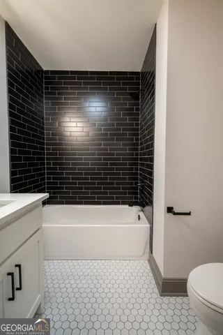 a balcony with wooden floor table and chairs
